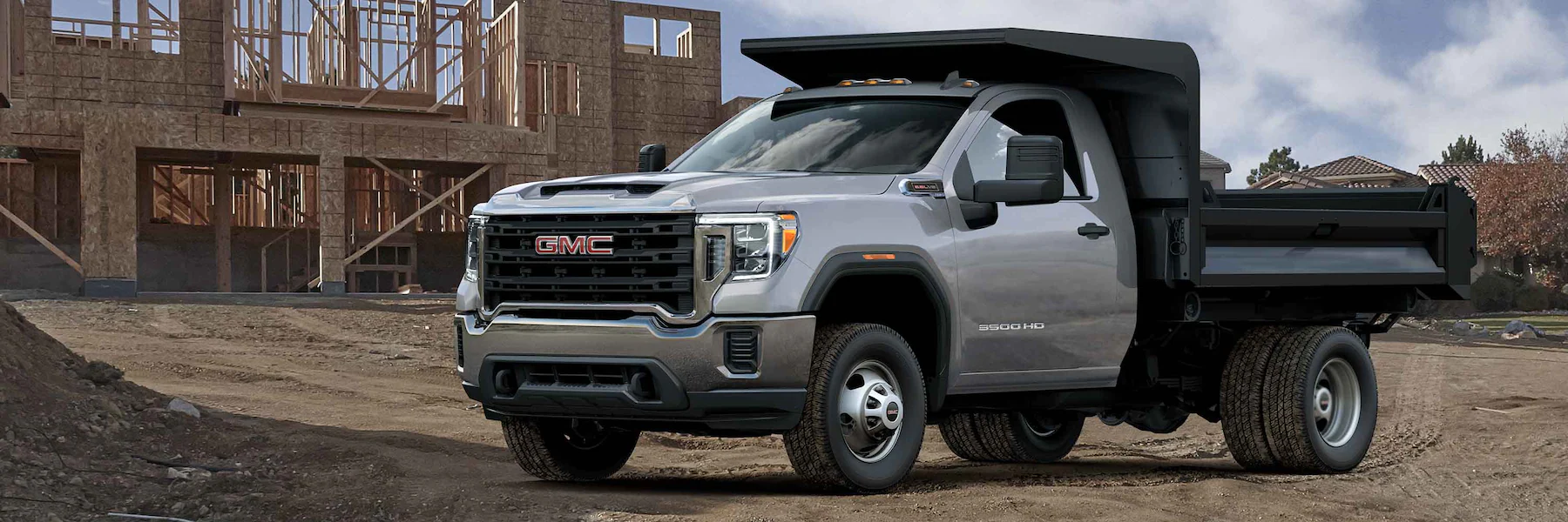 2023 GMC Sierra 3500 Chassis Cab at a construction site.